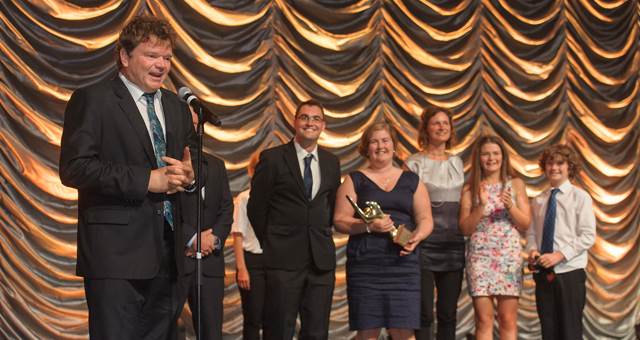 Robert Pennicott accepting an award on behalf of his family at the Qantas Australian Tourism Awards